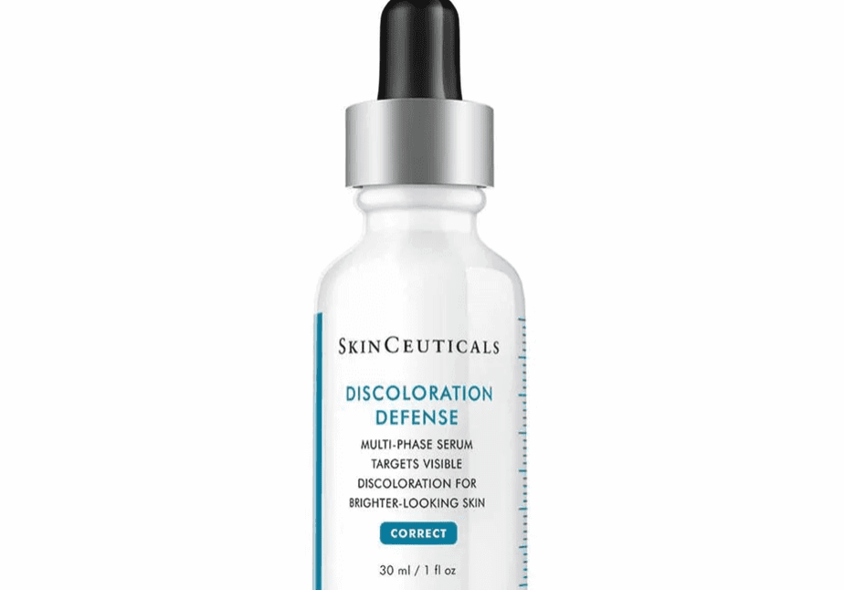 A bottle of SkinCeuticals Discoloration Defense serum with dropper.