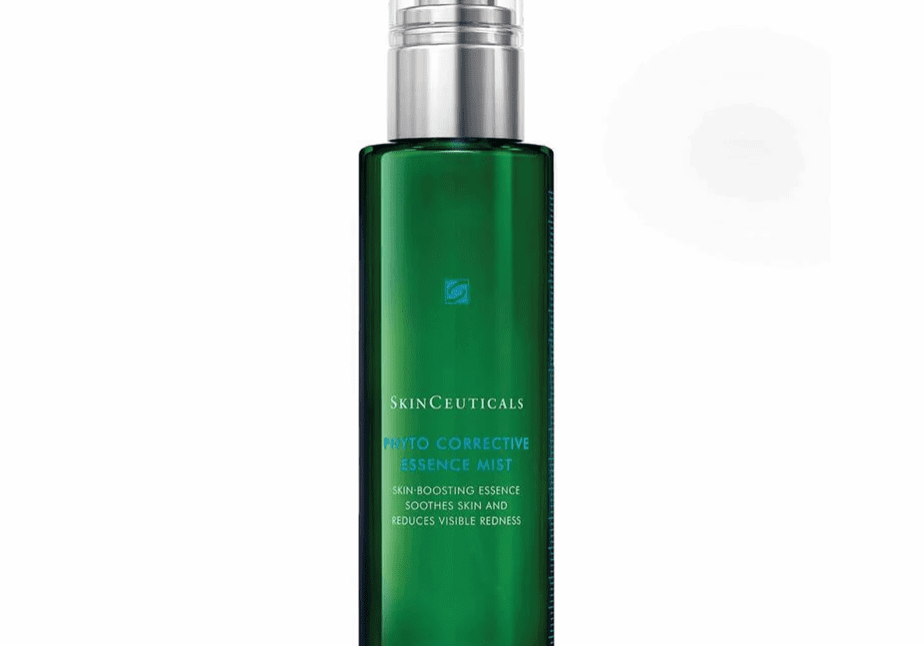 Green spray bottle of facial mist with a silver cap.
